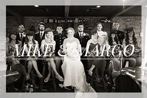 bridal party posing in Tun Tavern on bar stools at the Marine Corp Museum